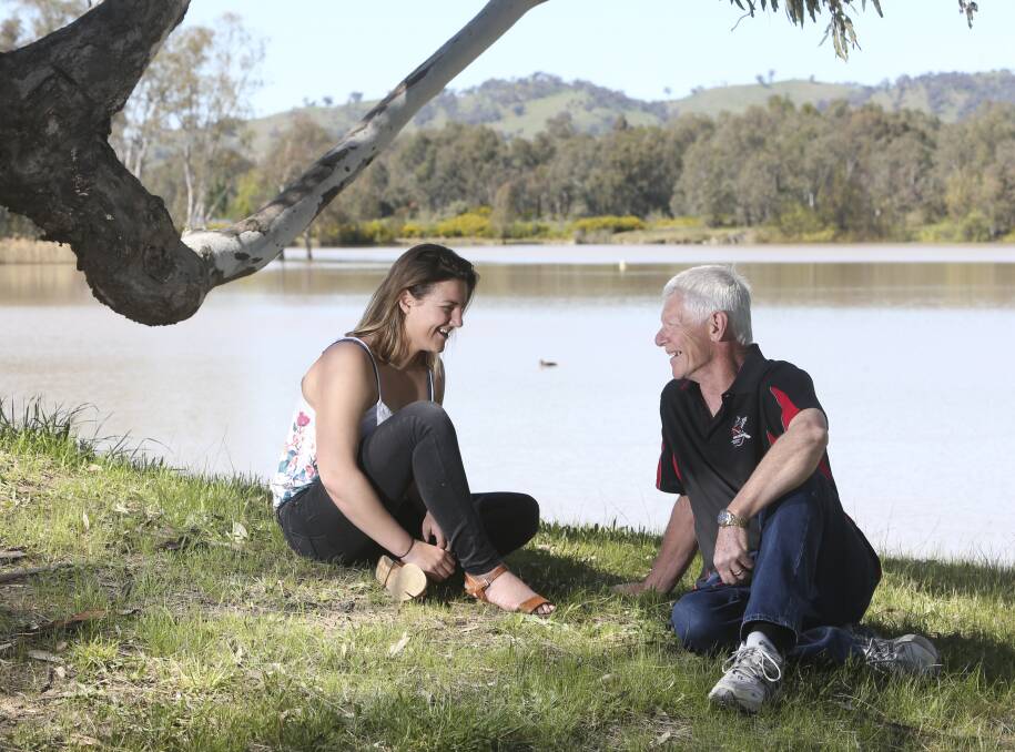 Merimbula lifesaver Beth Knox enjoys a relaxed chat with the man whose life she saved, heart attack victim Jack Earl, of Wodonga.