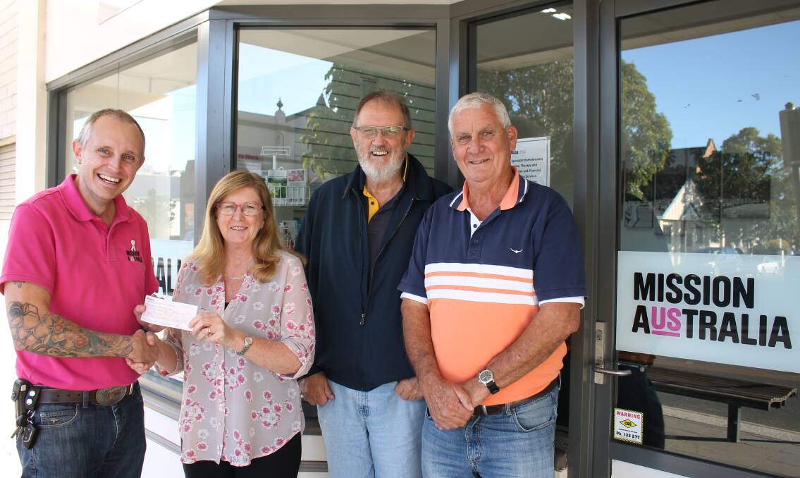 Mission Australia's South East NSW area manager Daniel Strickland thanks Pambula Rotary member Joan Macdonald, incoming president Colin Dunn, and outgoing president Daryl Dobson for their donation. 