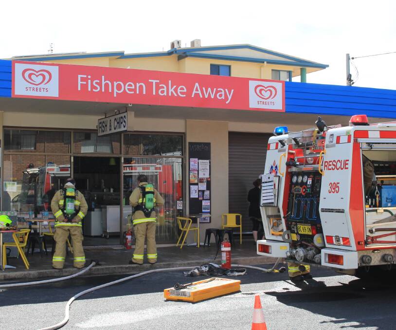 Fire officers check the premises at Fishpen Take Away after a fire in the kitchen caused by a fryer catching alight.