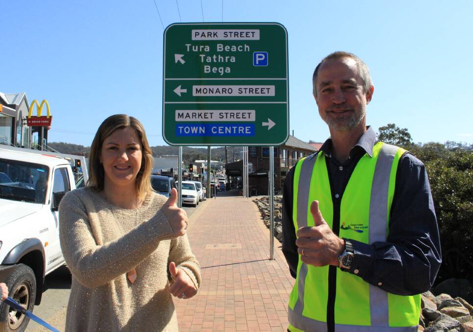 Mayor Kristy McBain and project engineer David Buckley in front of the new sign which shows a right hand turn into Market Street.