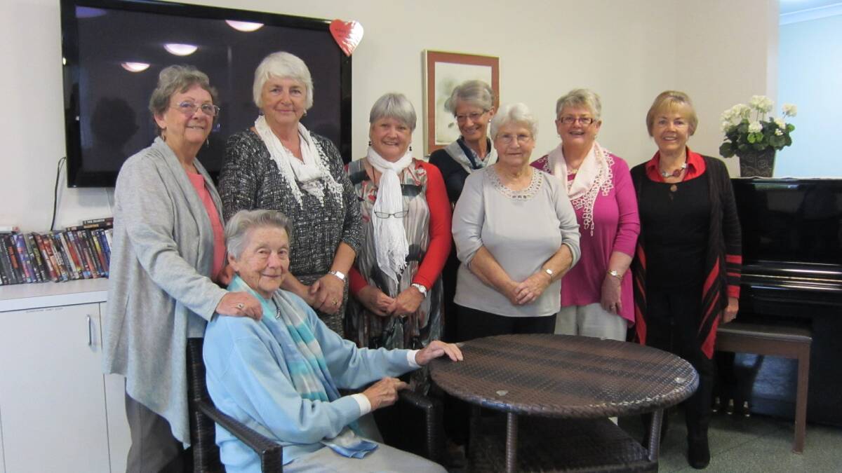 Imlay House Ladies Auxiliary members with one of the new outdoor furniture settings.