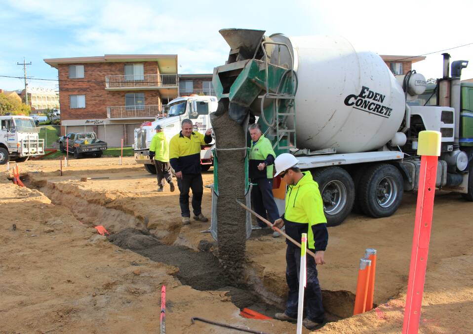 Trenches containing relocated services get backfilled with stabilised sand at the Merimbula bypass roadworks.