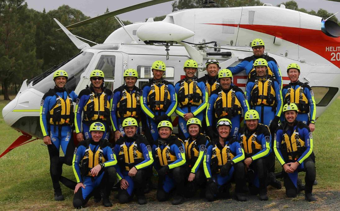 DOWN THE WIRE: Nicole Cooper, (centre front) of the Merimbula RFS, is one of 23 people in NSW trained to extract people from flood situations.