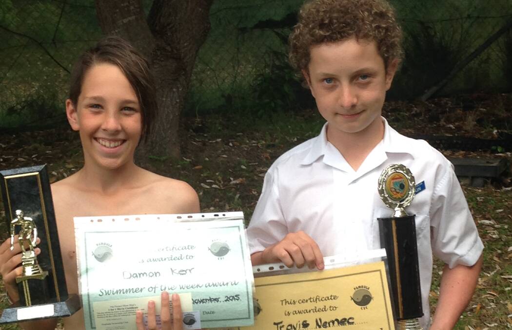 SWIM KINGS: Pambula Swim Club's top scorer for the week, Travis Nemec and swimmer of the week, Damon Kerr with their trophies and various vouchers.