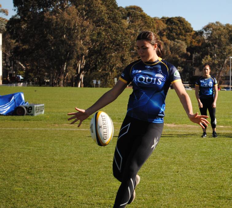 Cobargo's Millie Boyle fires off a kick during a training run with the ACT Brumbies last season with the lock named in the Wallaroos side. 