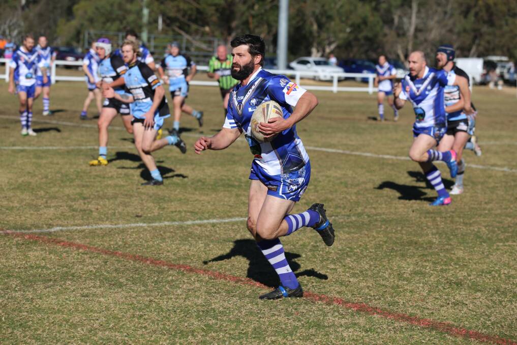 On the burst: Todd Bolton makes a line break to run 50-metres and score during a showdown with the Moruya Sharks on Saturday. 