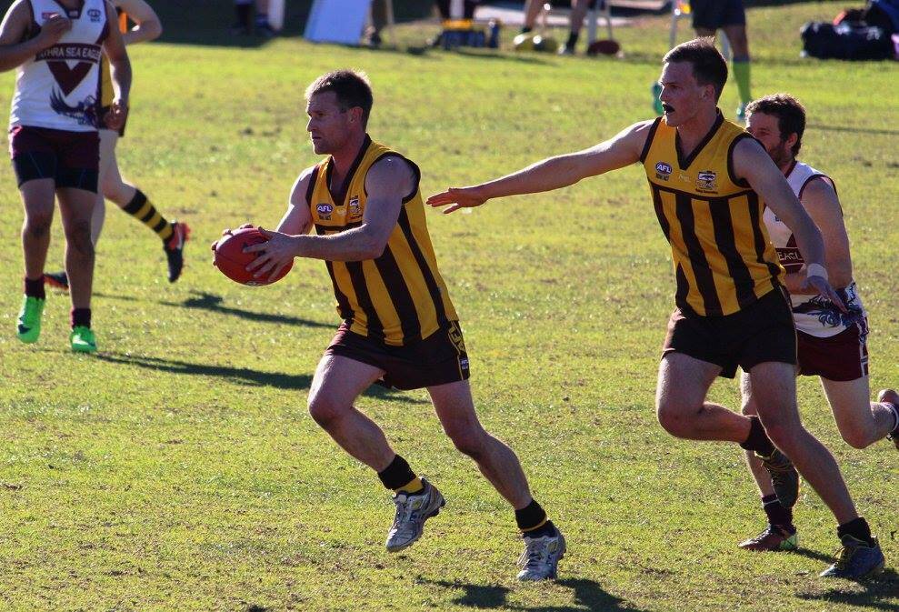 Forward movement: Sean Smith works the ball up the middle for the Pambula Panthers in their strong win over Tathra on Saturday. Picture: Jarrod Moore. 