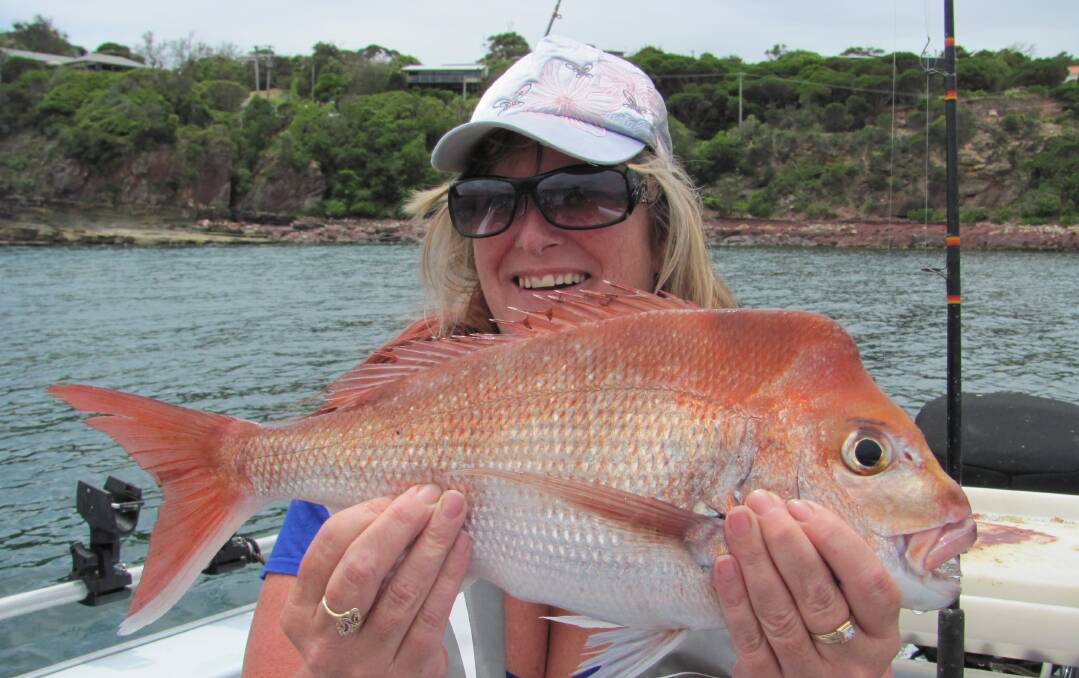 Simply red: Merimbula angler Lynette Duck shows a lovely catch-and-release snapper off Long Point.