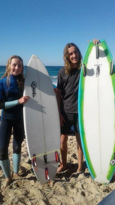Boards in hand: Arabella Tarpey and Harry Fergusson will contest a state surfing title after good results in the South Coast qualifier at Kiama. Picture: Supplied