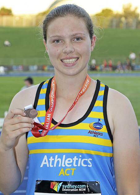 On track: Kiarna accepts the bronze at the Australian Junior Athletics Championships recently with ongoing fundraising efforts for the young gun to compete in Canada in July. 
