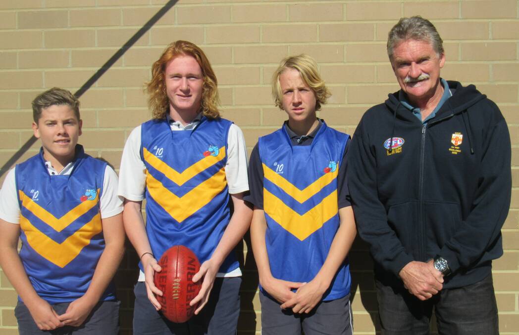 Aussie rules convenor Phil Jackson with Caleb Higgins, Jedd Martyn and Max Geaghan, who will play in the Tunas side at a state carnival. 