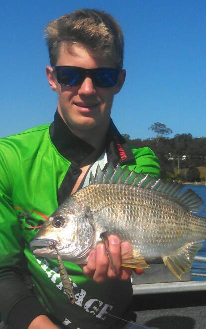 Great catch: Jasper Dulhunty shows a fine Bream caught on a hard bodied plastic lure in Pambula Lake. Picture: Contributed