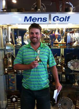 Trophy moment: Tura Beach hole-in-one shooter Michael Arnaudon.