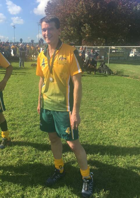 Green and gold: Bega's Michael Collins decked out in the national squad gear at the Masters Hockey Trans Tasman Test where his team won .
