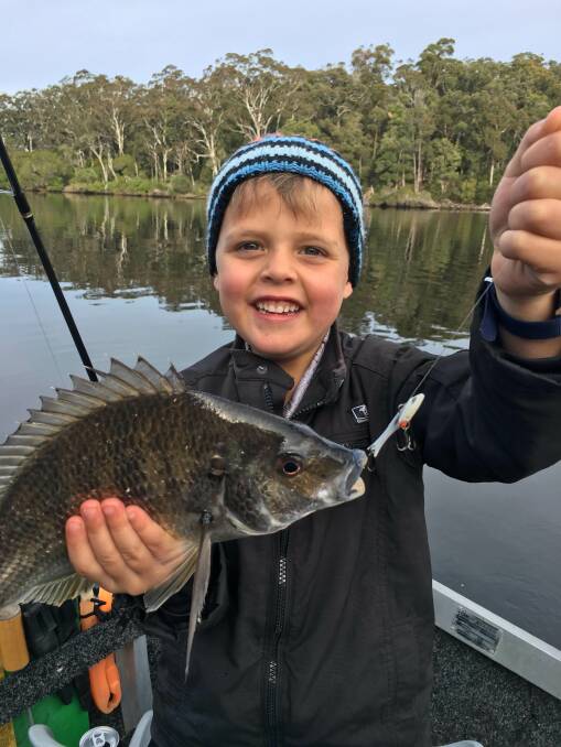 Great catch!: Seven-year-old Kade Jenkins of Berrambool shows a beautiful bream caught and released in the Pambula Lake.