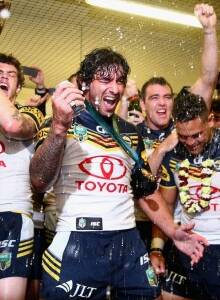 Winners: The Cowboys celebrate their first NRL premiership. 