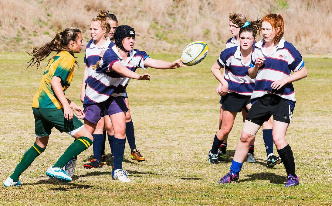Safe hands: Lumen Christi's Samantha Crowley fires off a pass during a recent rugby match and played well for the Falcons recently.. Picture: Facebook. 