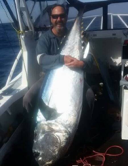 Quite a haul: Local angler Trevor Chippendale with a magnificent bluefin tuna. 
