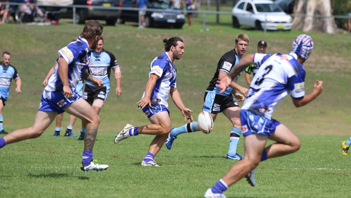Kicking clear: Tom McMillan kicks a chip against the Moruya Sharks during the Nines with the Bulldogs to host the Sharks in the next round.