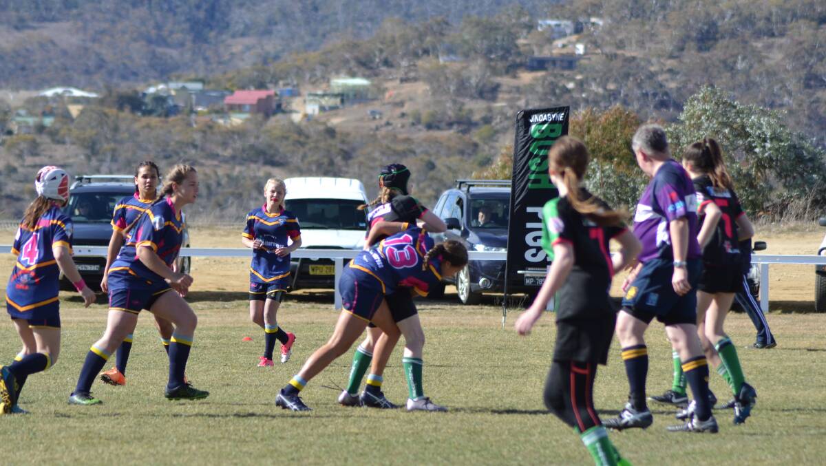 Good tackle: Falcon Bella Kiely making a tackle with Rosalie Craddock coming up in support when the Falcons met Jindabyne over the weekend.