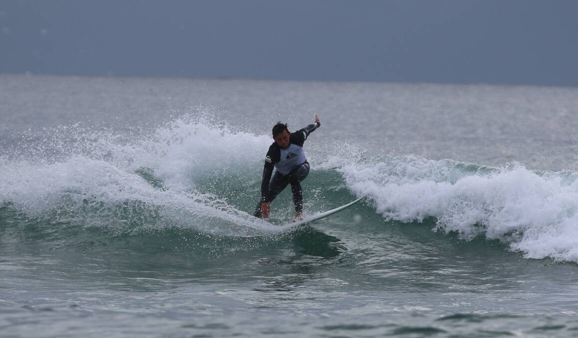 Nice turn: One of the early entrants gets to grips with a wave during the first heats on Saturday morning. 