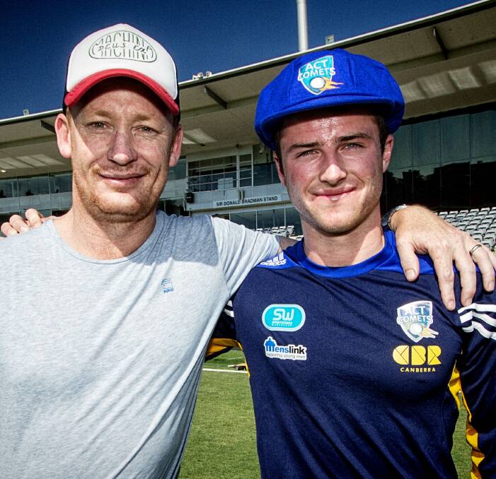 Promotion: Canberra Comets legend Cade Brown with Mac Wright after a special cap presentation. Picture: Cameron Walter