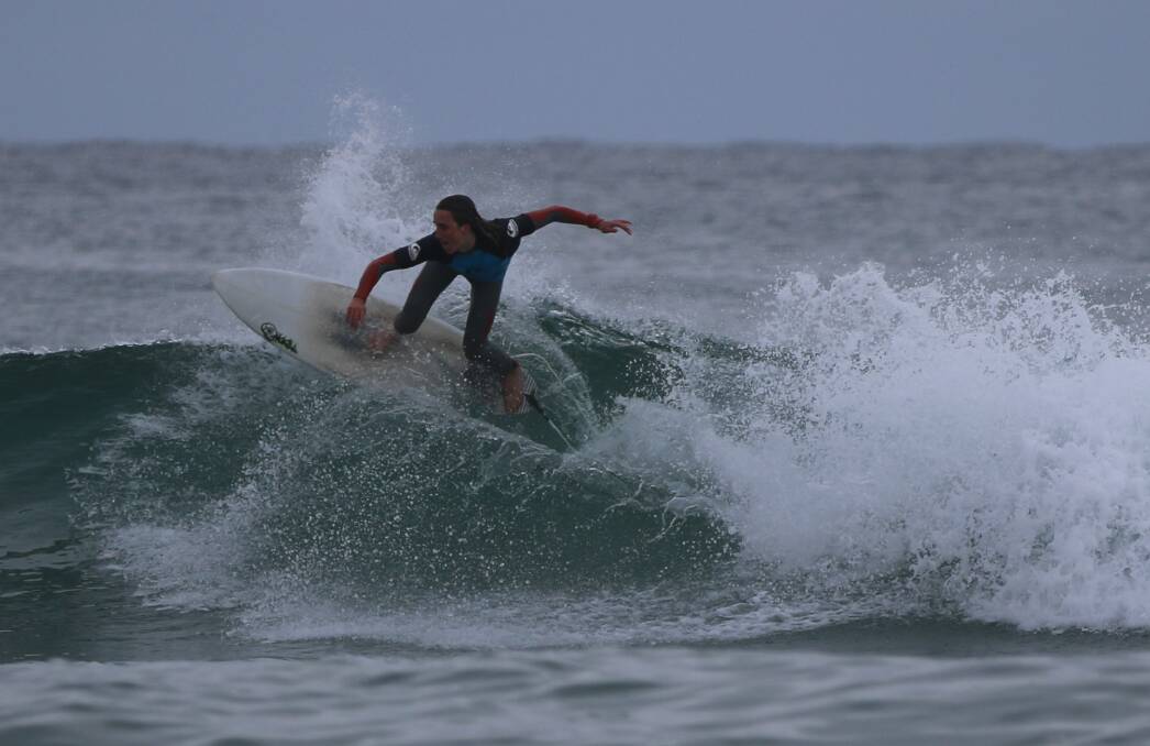 Morning swell: A Sapphire Coast Boardrider junior surfer carves up the lip of a wave during the club's most recent meet. 