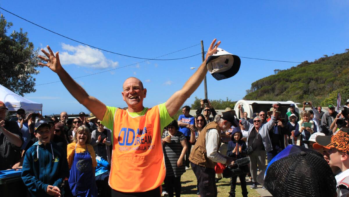 Dane Waites arrives home on September 30 to a rapturous welcome after running the 4000km from Perth to Pambula over three months. Picture: Denise Dion