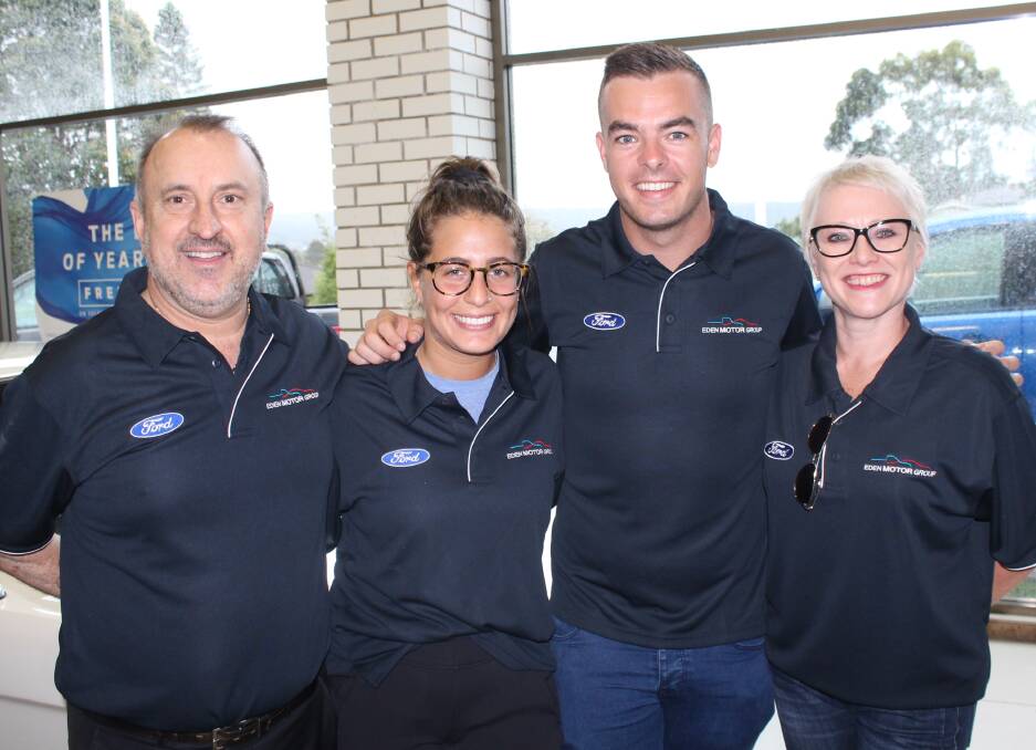 ALL SMILES: Scott McLaughlin (second right) with the Eden Motor Group team ahead of the Newcastle 500. Photo: Zach Hubber