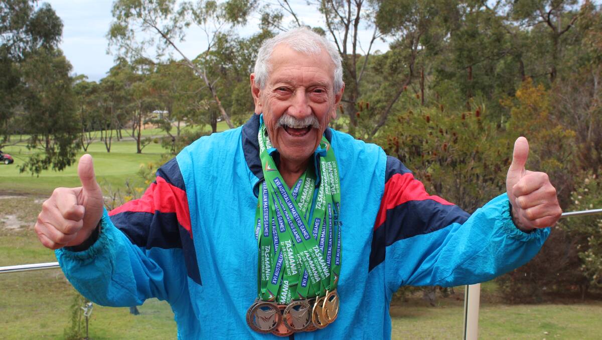 THUMBS UP: Alan Cameron was all smiles at his Tura Beach home after returning from Tasmania with nine medals, including two gold, at the Australian Masters Games. Photo: Zach Hubber
