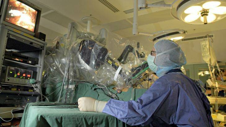 A surgeon performing robotic surgery. Photo: Michael Rayner
