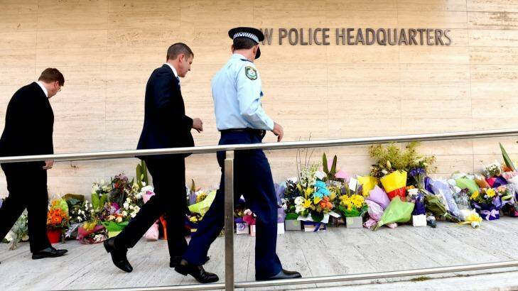 Police officers want a national case management system to investigate terrorism incidents, such as the shooting of Curtis Cheng outside police headquarters in Parramatta. Photo: Steven Siewert