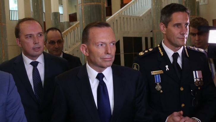 Immigration Minister Peter Dytton, Prime Minister Tony Abbott and Australian Border Force Commissioner Roman Quaedvlieg. Photo: Andrew Meares