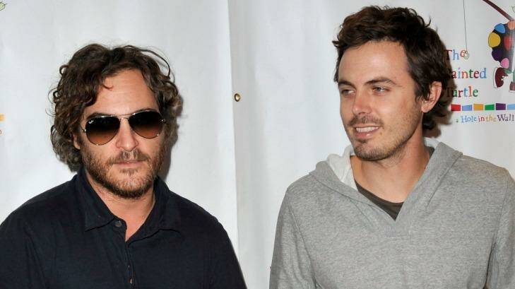 Affleck, right, with his brother-in-law Joaquin Phoenix in October 2008. Photo: Kevin Winter