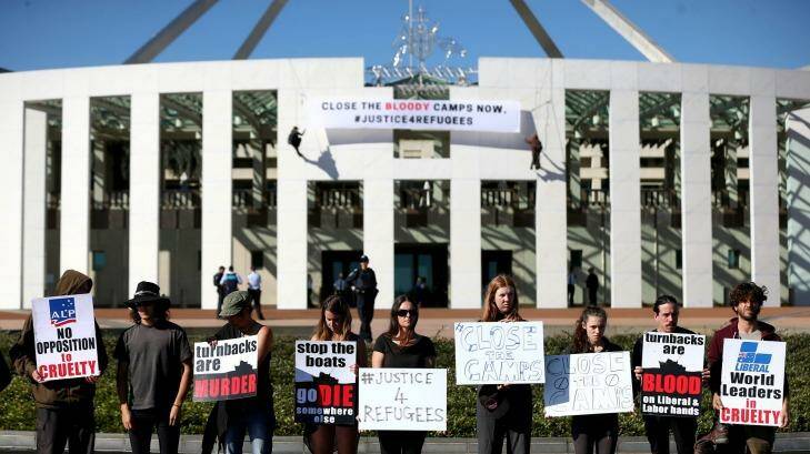 Protestors on the forecourt of Parliament House in Canberra on Thursday.  Photo: Alex Ellinghausen