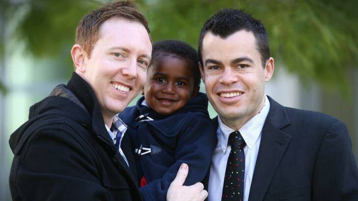 Jason Haines with partner David Momcilovic and their son Oliver are in Canberra to attend Bill Shorten's introduction of a private members bill on marriage equality. Photo: Andrew Meares