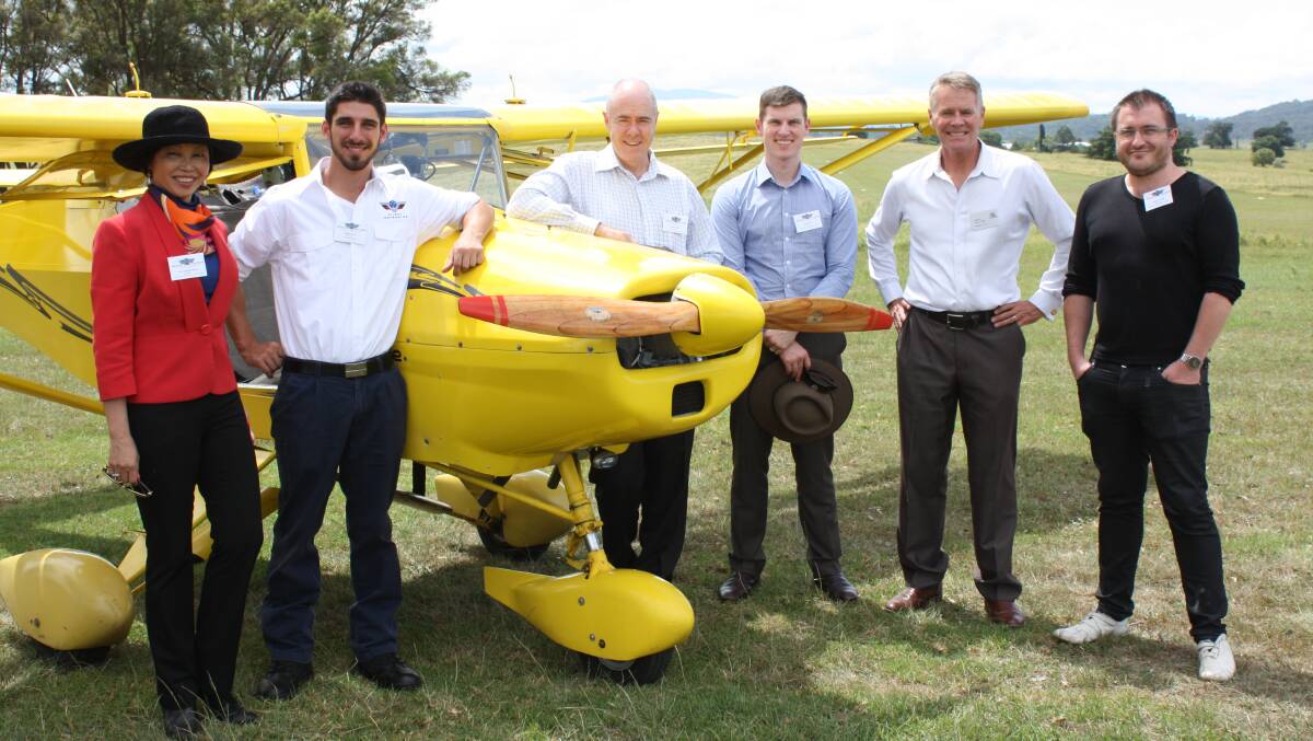 Discussing plans for a Chinese flight school at Frogs Hollow are Member for Oxley and former Deputy Premier Andrew Stoner (second from right) and company directors of Sports Aviation Australia (from left) Caroline Hong, Mitch Boyle, Jason Parker, Jason Ryan and Brad Stebbing.