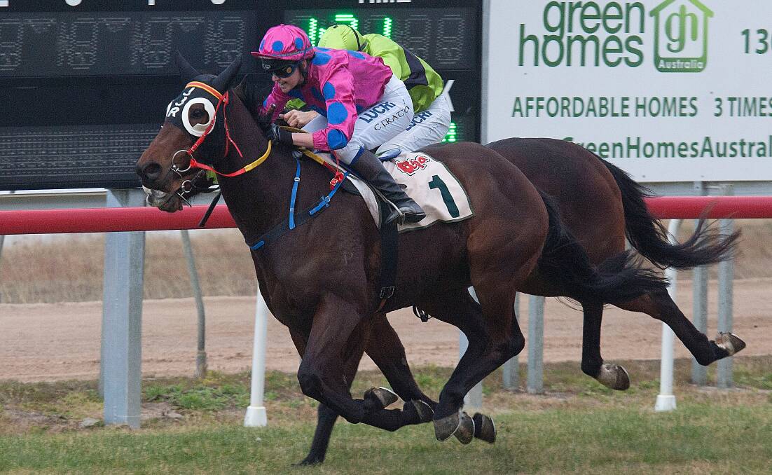 • Carly Frater (left) rides Jockarli to success in the sixth race of the day