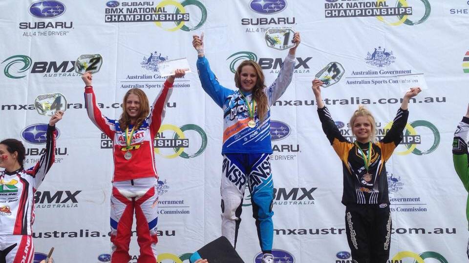 Tahlia Waldon (centre) takes the podium after winning the under 16s Australian BMX Championship in Shepparton, Victoria, recently. 