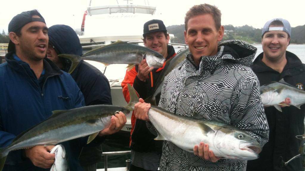 RAINY KINGS: The Lindsay Higgins bucks day boys with some of the nice kings caught on Saturday with Narooma Charters braving the wind and rain can provide dividends. John Stevens is pictured in foreground right with his 87cm king. (9/4/14)