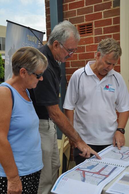 Jenny Seller, of Merimbula, left, Andrew Pattie, Berrambool and Hedley Seller, Merimbula inspect the plans. Mr Pattie, who is secretary of Merimbula Tourism Inc, thought the plans provided “an overall good basis to determine the establishment of the town’s design principles”. It was a “good presentation” and provided a talking point. He said that Merimbula Tourism, the Merimbula Chamber of Commerce and the Special Events Committee were in favour of removing the Visitor Information Centre from its Beach Street location and establishing a new centre at the southern end of the boat ramp car park. It also had been the subject of discussion with the council, Mr Pattie said.  