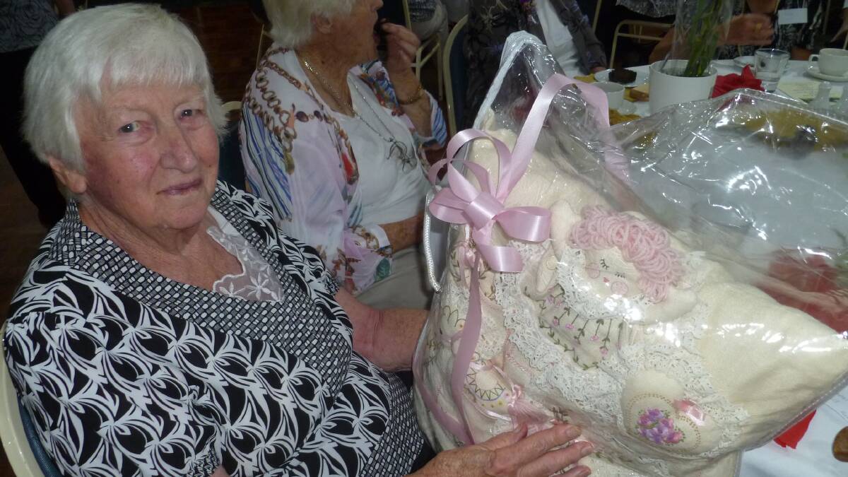 Pambula District Hospital Auxiliary member, Win Rowlands won the raffle which was a cushion, meticulously embroidered by Rose Barker. 