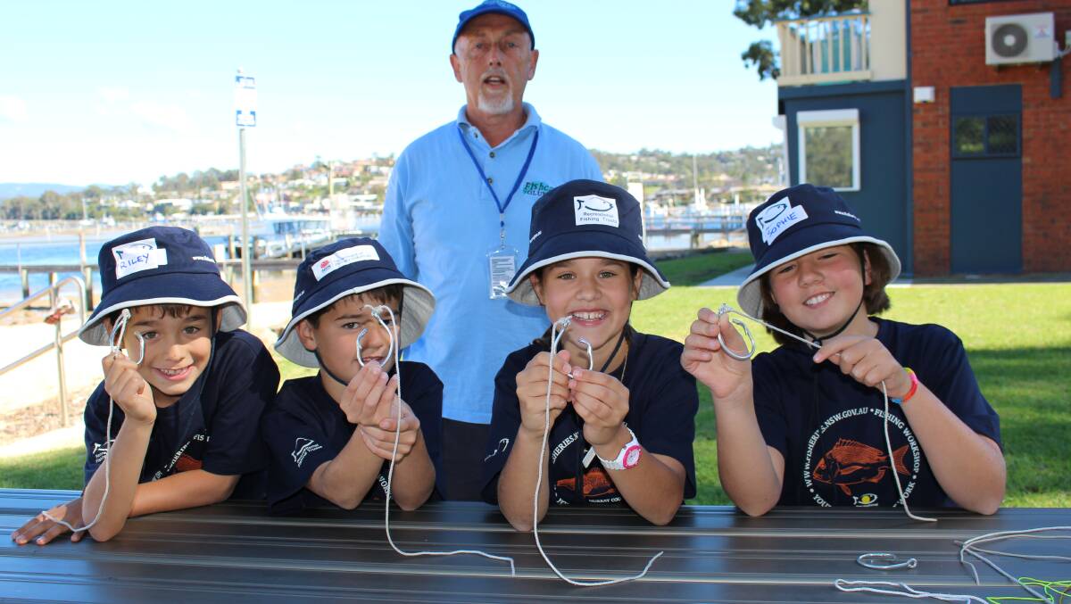 Riley Meale, left, Lachie Watson, Ainsley Meale and Sophie Watson, all of Sydney, had no trouble getting to grips with their knots after having the expert help of volunteer, Jim Clarke (back). 