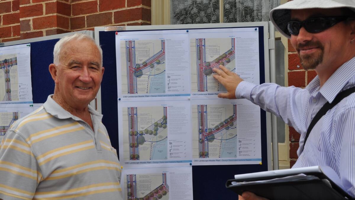 Simon Terry, of Merimbula, discusses CBD landscape plans with Tim Buykx, senior associate with council’s consultant Landscape Architect, Spiire, outside Twyford Hall, Merimbula.  Mr Terry gave the plans the thumbs down.“The plans need to go back to the drawing board.” He said traffic flows had not been adequately addressed.  He thought the hiring of consultants was a waste of money and that the locals could have done as good a job.  