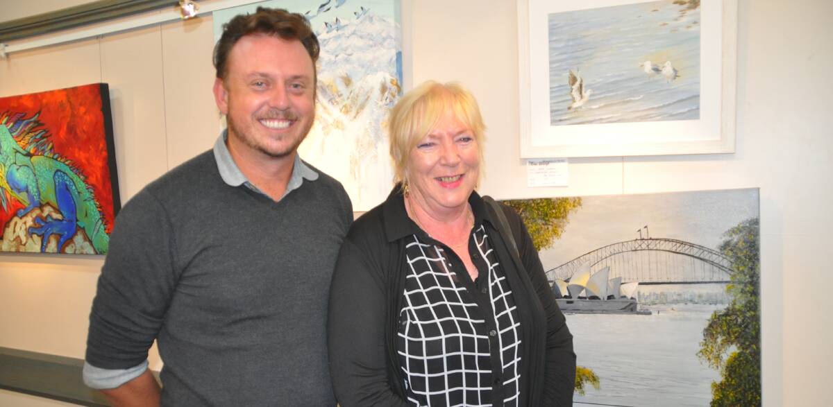 Iain Dawson and Liz Akmentins. Iain, who went to school in Eden and since lived in Sydney, has just taken up the position of Bega Valley Regional Gallery Curator. Liz’s painting of the Sydney Harbour scene reminded Iain of his time there too. 