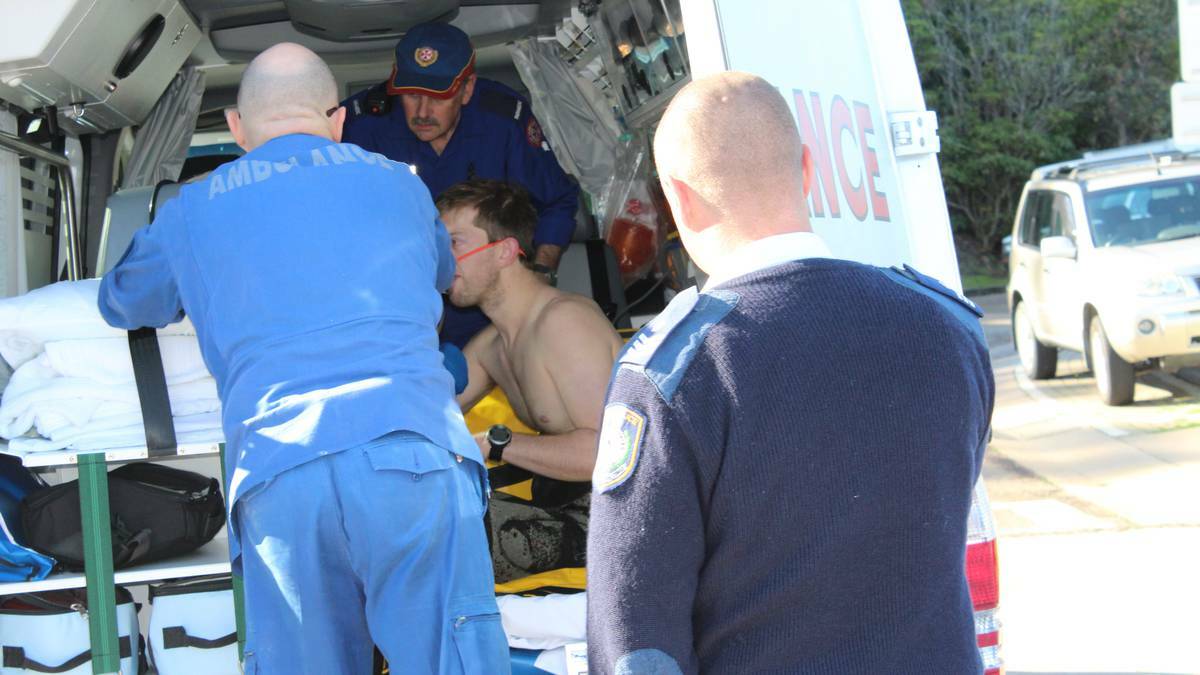 The diver is passed into the care of paramedics before being  airlifted to Canberra.