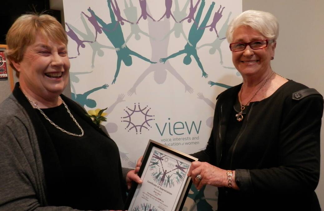 Helen Ellwood receiving an appreciation certificate  from Gwen Scorgie, Merimbula  Evening View Club committee member.