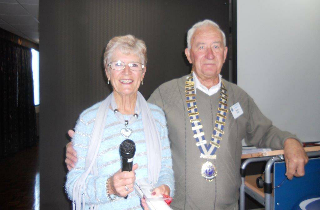 Judi Lawrence, a very recent inductee to the
Probus Club Of Merimbula, with president, Simon Terry. 