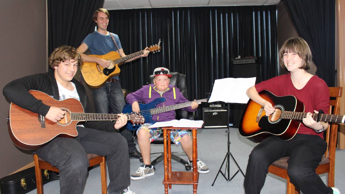 Owner and teacher at Merimbula School of Music Ricky Bloomfield, back, with three of his students, 15-year-old Brock Brunning of Tura Beach, 11-year-old Pat Thompson of Merimbula and 15-year-old Alicia Munt of Pambula. 