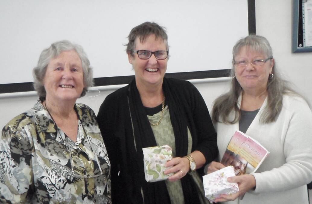 Vice president of the Pambula-Merimbula CWA Barbara Davy left, presenting our guest speakers, Therese and Lee-Anne with small gifts of thanks.